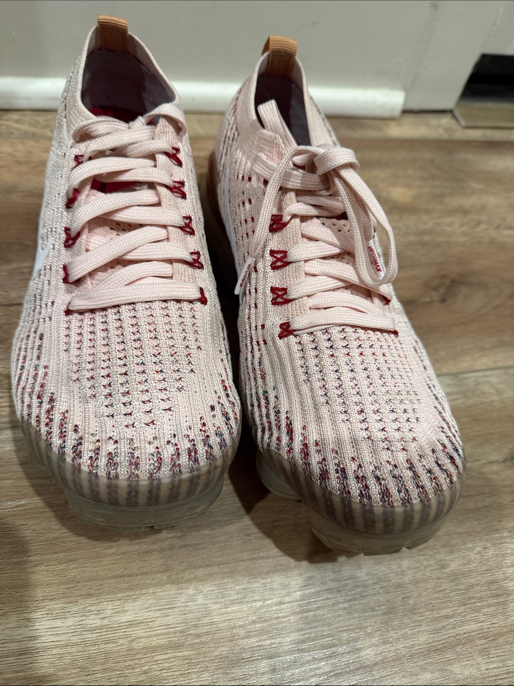 Nike Women’s Light Pink Knit VaporMax Sneakers with White Swoosh